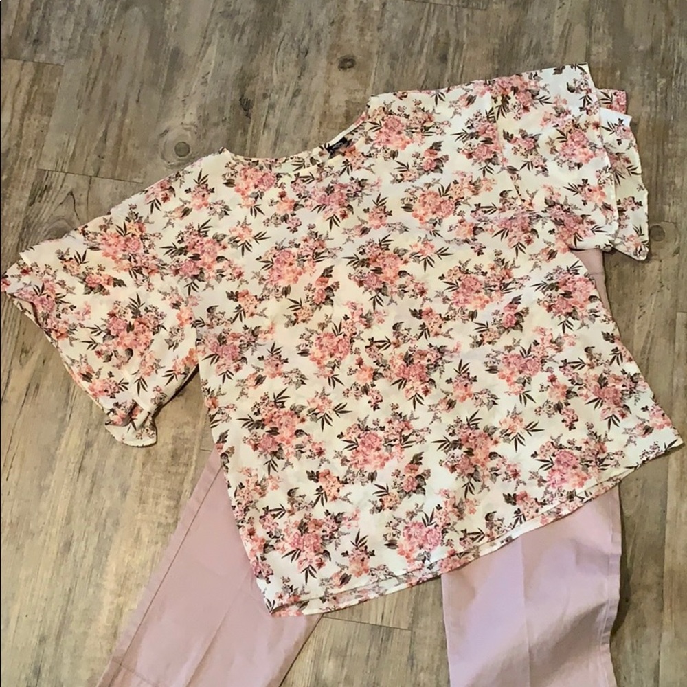 Soft, flowing shirt with ruffles on the sleeves.